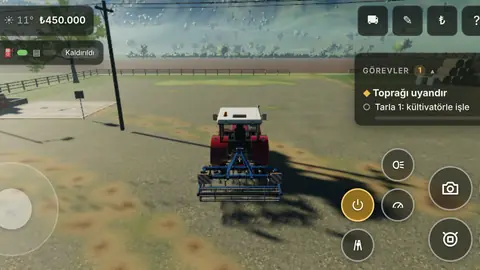 Driving the tractor with touch controls on a phone